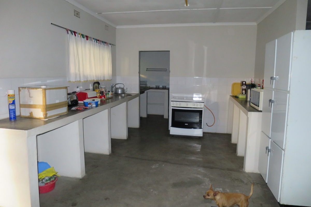 a kitchen with scullery at back